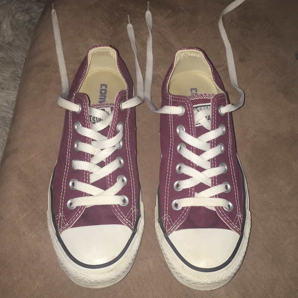 Maroon and white Chuck Taylor converse shoes
